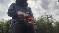 Worker cum with watermelon. Thumb