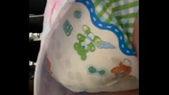 Girl messing diaper under dress Thumb