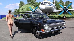Soviet plane, black Volga and nude model Thumb