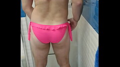 Boy wearing sexy pink swimsuit Thumb