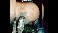 Slutty transvestite wallowing in the mud, putting bottles up her ass Thumb